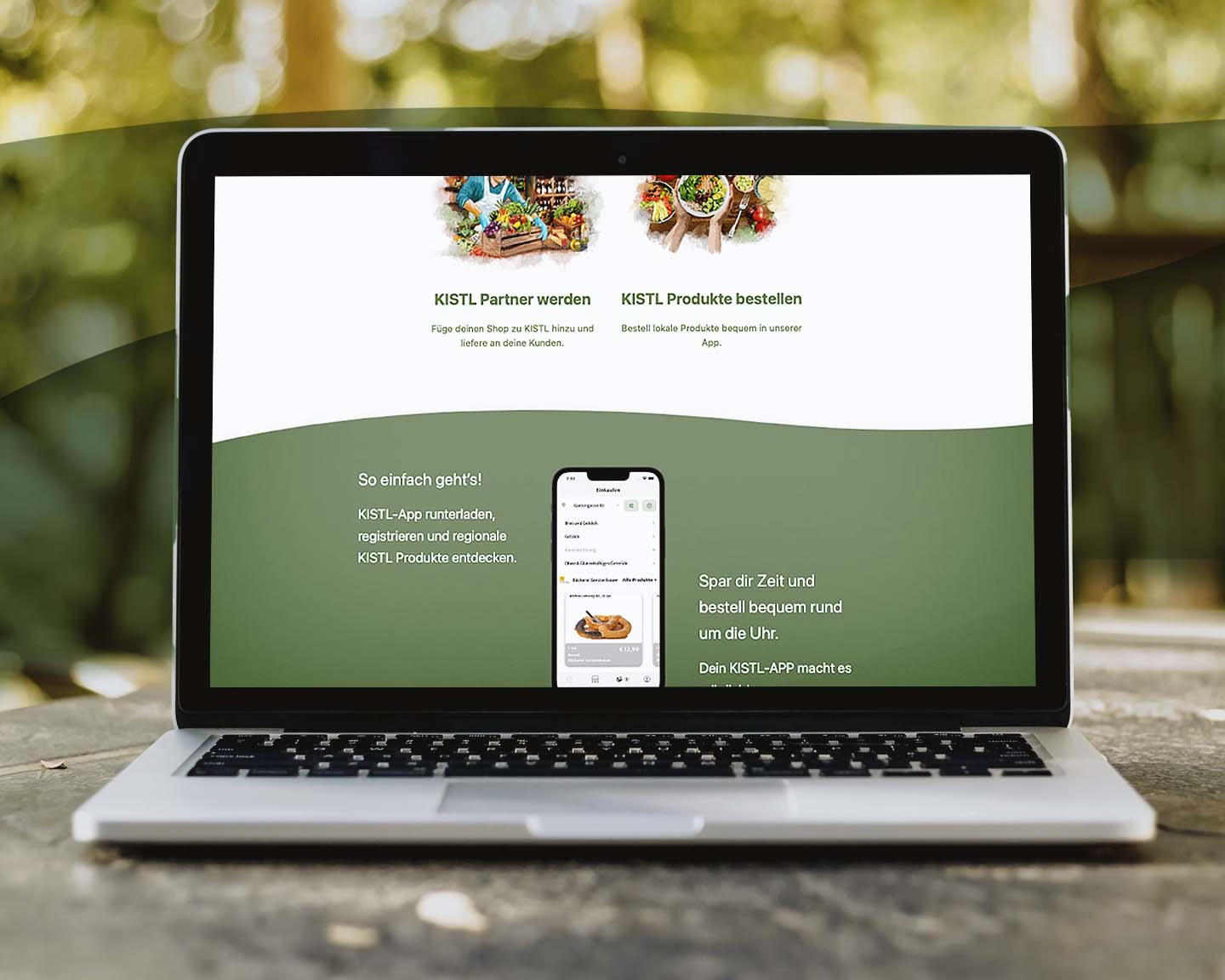 Laptop zeigt Website der KISTL-App mit Infos zur Bestellung regionaler Produkte und Partner-Option für Händler.