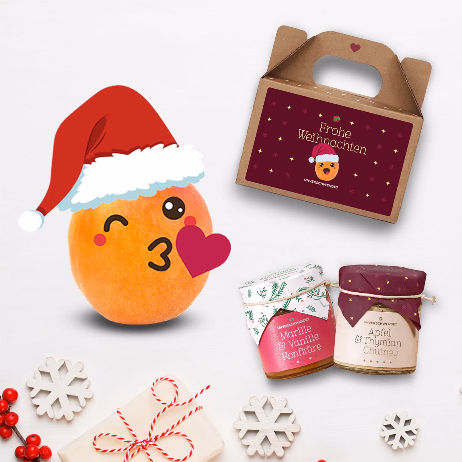 Weihnachtliches Geschenkset von Unverschwendet mit Marille-Vanille-Konfitüre, Apfel-Thymian-Chutney und festlicher Box.