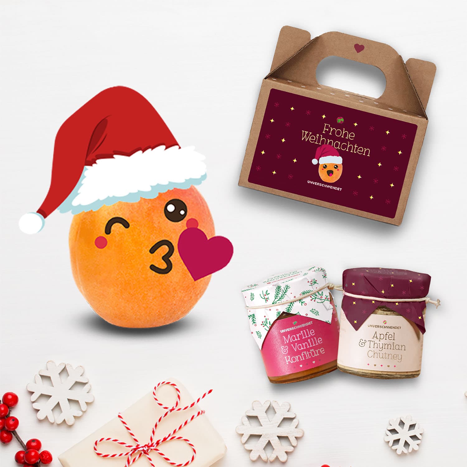 Weihnachtliches Geschenkset von Unverschwendet mit Marille-Vanille-Konfitüre, Apfel-Thymian-Chutney und festlicher Box.