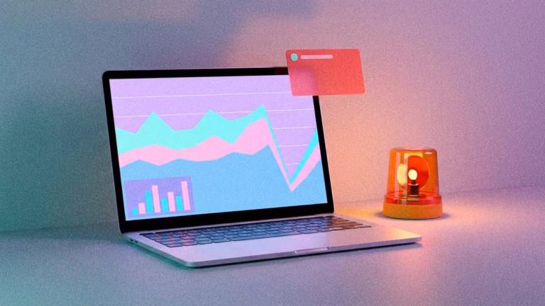 Laptop mit Diagramm und Warnleuchte.